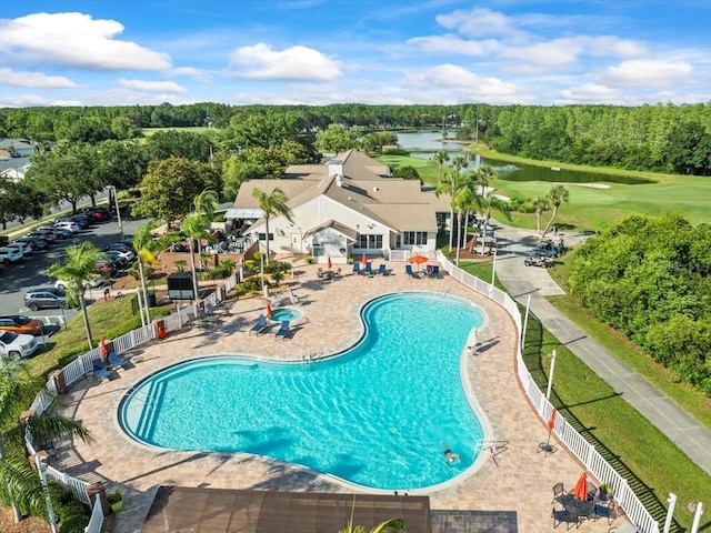 7606 Berna Ln, Land O Lakes, FL 34637 - community pool featuring a water view, golf course view, and a patio area