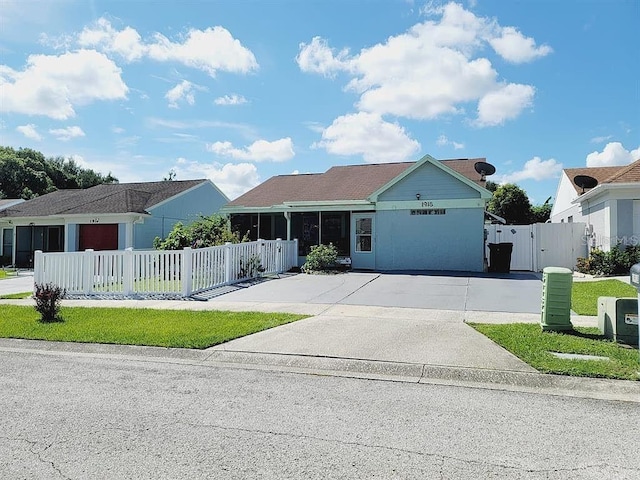 1918 Crown Park Dr, Valrico, FL 33594 - ranch-style house featuring a gate, a fenced front yard, and concrete driveway