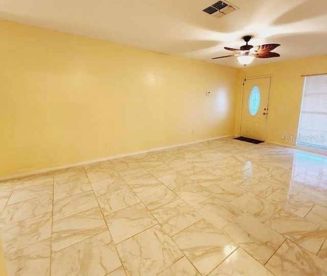 1918 Crown Park Dr, Valrico, FL 33594 - foyer with ceiling fan and light marble finish flooring