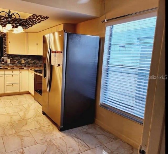 1918 Crown Park Dr, Valrico, FL 33594 - kitchen with stainless steel fridge with ice dispenser, light marble finish flooring, range, and white cabinetry