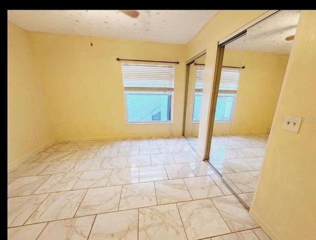 1918 Crown Park Dr, Valrico, FL 33594 - unfurnished room with light marble finish floors and baseboards