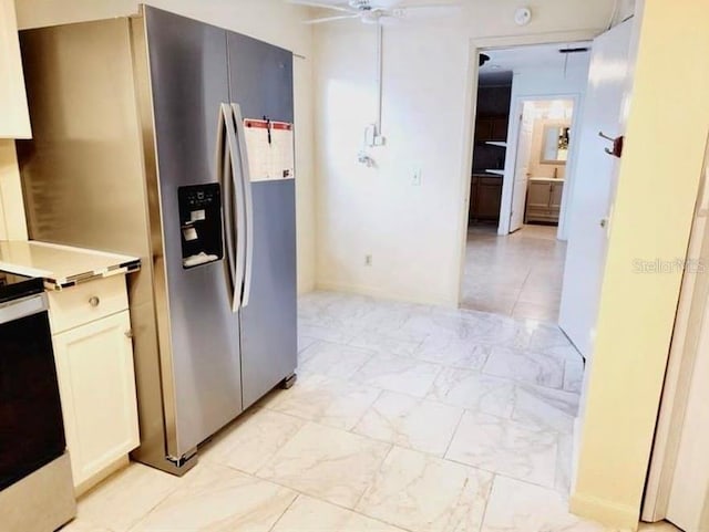 1918 Crown Park Dr, Valrico, FL 33594 - kitchen with stainless steel appliances, a ceiling fan, light countertops, and light marble finish flooring
