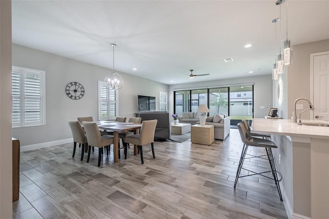12652 Shetland Walk Dr, Lithia, FL 33547 - dining space with ceiling fan, recessed lighting, a chandelier, and light wood-type flooring