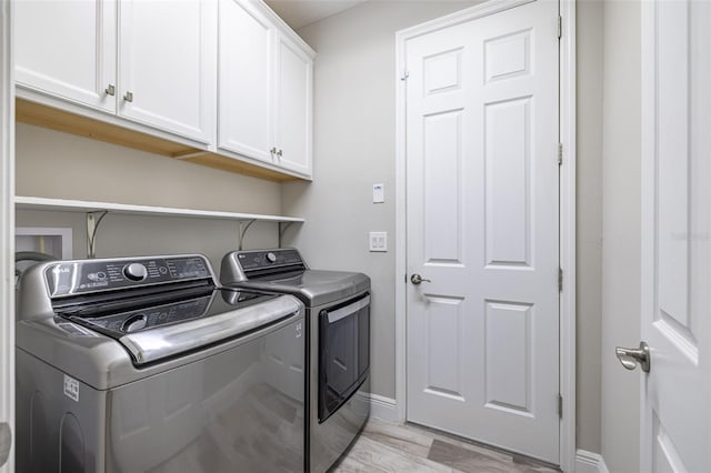 12652 Shetland Walk Dr, Lithia, FL 33547 - laundry area featuring washing machine and clothes dryer and cabinet space