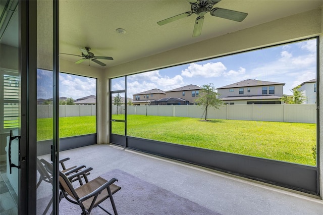 12652 Shetland Walk Dr, Lithia, FL 33547 - unfurnished sunroom featuring a ceiling fan and a residential view