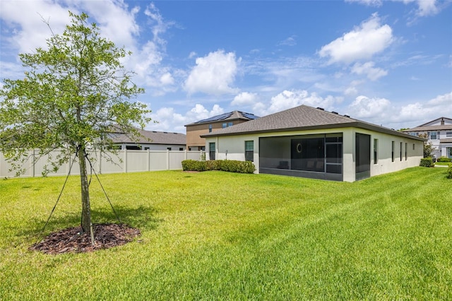 12652 Shetland Walk Dr, Lithia, FL 33547 - back of house featuring a sunroom, stucco siding, and roof with shingles