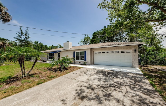 7332 Janczlik Dr, New Port Richey, FL 34652 - ranch-style house with brick siding, a garage, concrete driveway, a chimney, and a front yard