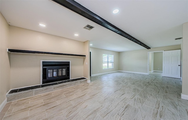 7332 Janczlik Dr, New Port Richey, FL 34652 - unfurnished living room featuring beamed ceiling, a tile fireplace, and recessed lighting