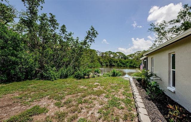 7332 Janczlik Dr, New Port Richey, FL 34652 - view of green lawn featuring a water view
