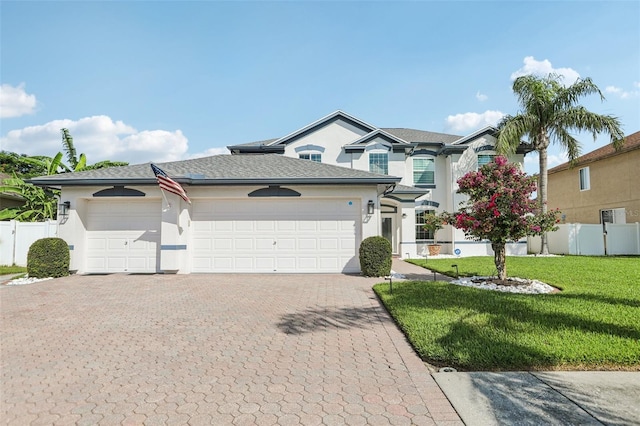 1802 Regal Mist Loop, Trinity, FL 34655 - view of front of property featuring stucco siding, decorative driveway, and an attached garage