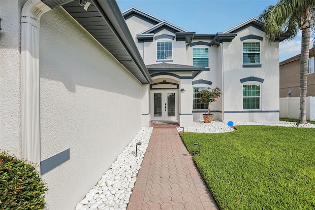 1802 Regal Mist Loop, Trinity, FL 34655 - view of exterior entry with french doors and stucco siding