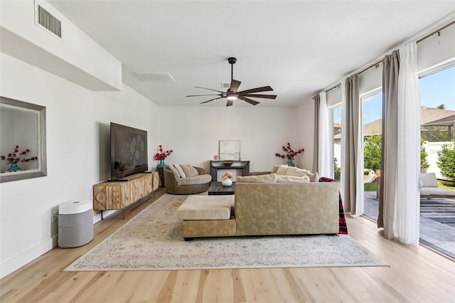 1802 Regal Mist Loop, Trinity, FL 34655 - living area with wood finished floors and a ceiling fan