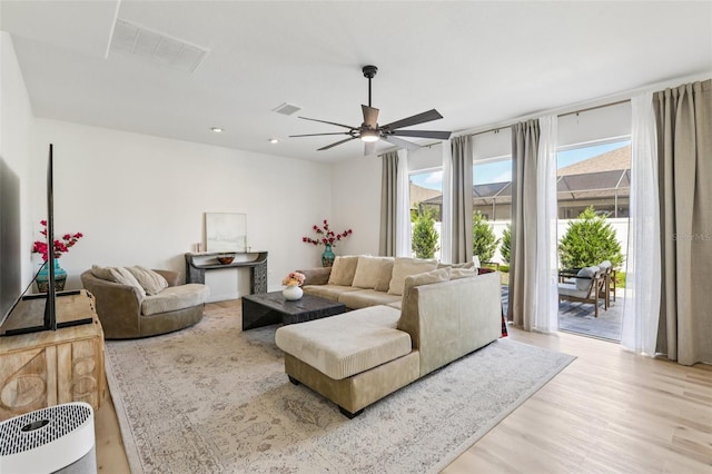 1802 Regal Mist Loop, Trinity, FL 34655 - living area featuring light wood-type flooring, ceiling fan, and recessed lighting