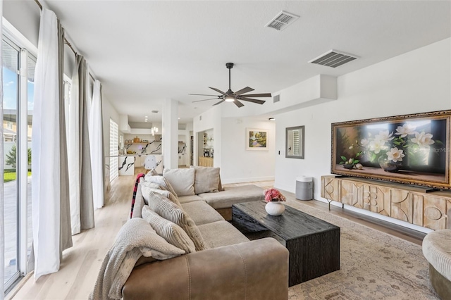 1802 Regal Mist Loop, Trinity, FL 34655 - living area with ceiling fan and light wood finished floors