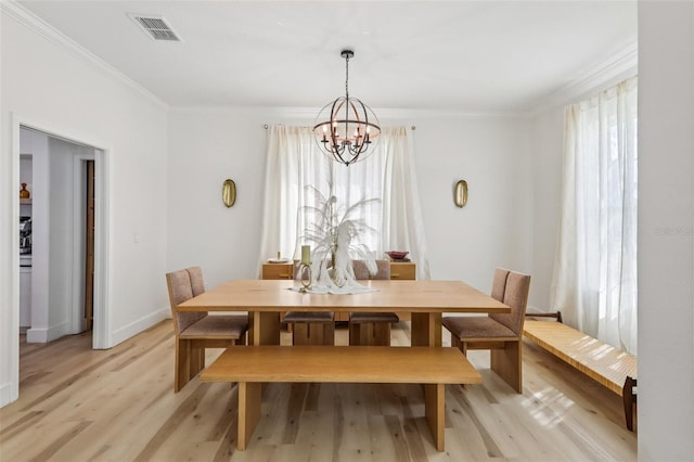 1802 Regal Mist Loop, Trinity, FL 34655 - dining space with a chandelier, crown molding, and light wood-style floors
