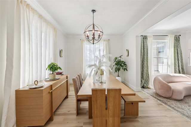 1802 Regal Mist Loop, Trinity, FL 34655 - dining area with a chandelier, light wood-style floors, and crown molding