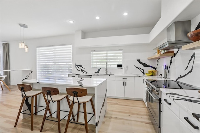 1802 Regal Mist Loop, Trinity, FL 34655 - kitchen with electric range oven, open shelves, a kitchen bar, light wood-style flooring, and white cabinetry
