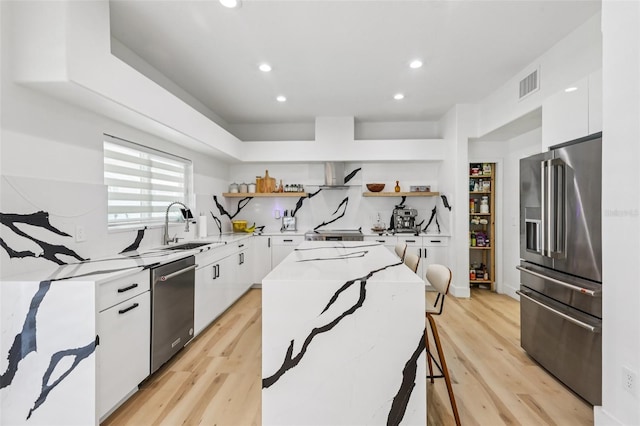 1802 Regal Mist Loop, Trinity, FL 34655 - kitchen featuring appliances with stainless steel finishes, open shelves, recessed lighting, white cabinetry, and a center island