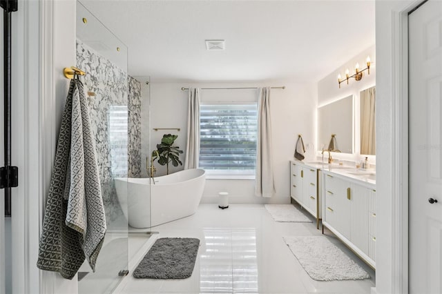 1802 Regal Mist Loop, Trinity, FL 34655 - bathroom with healthy amount of natural light, double vanity, a soaking tub, and a shower