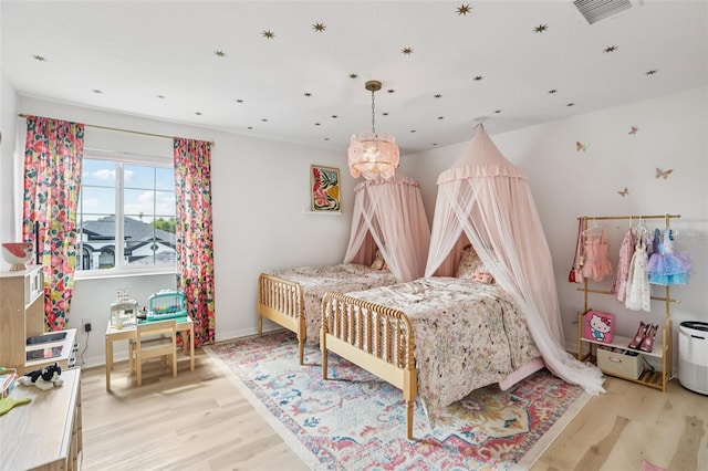 1802 Regal Mist Loop, Trinity, FL 34655 - bedroom featuring light wood-style floors and baseboards