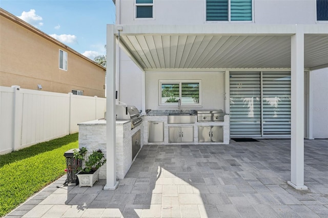 1802 Regal Mist Loop, Trinity, FL 34655 - view of patio with a sink and an outdoor kitchen