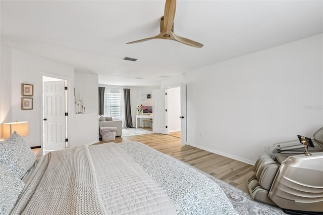 1802 Regal Mist Loop, Trinity, FL 34655 - bedroom with light wood-style flooring and a ceiling fan