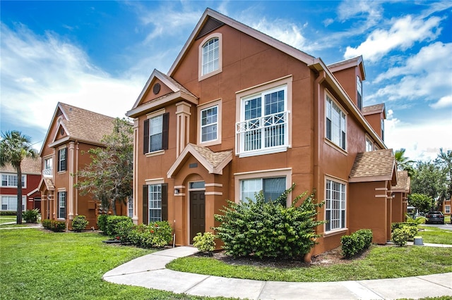 10520 White Lake Ct Unit 10520, Tampa, FL 33626 - view of front of property featuring stucco siding and a front lawn