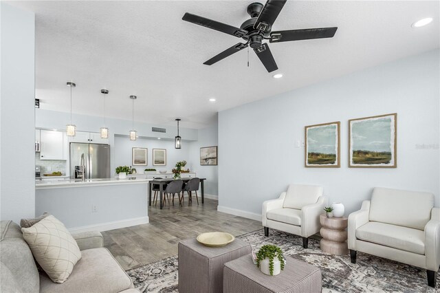 10520 White Lake Ct Unit 10520, Tampa, FL 33626 - living room featuring light wood finished floors, a ceiling fan, and recessed lighting
