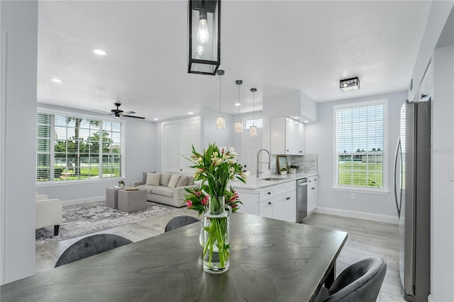 10520 White Lake Ct Unit 10520, Tampa, FL 33626 - dining area with light wood finished floors, recessed lighting, and ceiling fan