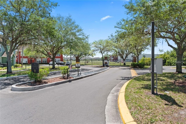 10520 White Lake Ct Unit 10520, Tampa, FL 33626 - view of asphalt street featuring curbs, sidewalks, and street lights