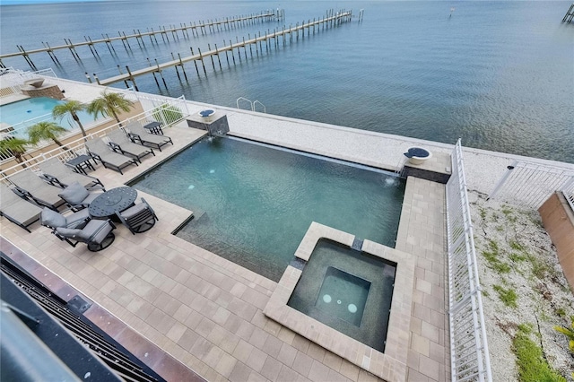 6418 Bright Bay Ct, Apollo Beach, FL 33572 - view of swimming pool with a water view, a boat dock, a pool with connected hot tub, and a patio
