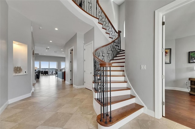 6418 Bright Bay Ct, Apollo Beach, FL 33572 - stairway featuring baseboards and recessed lighting