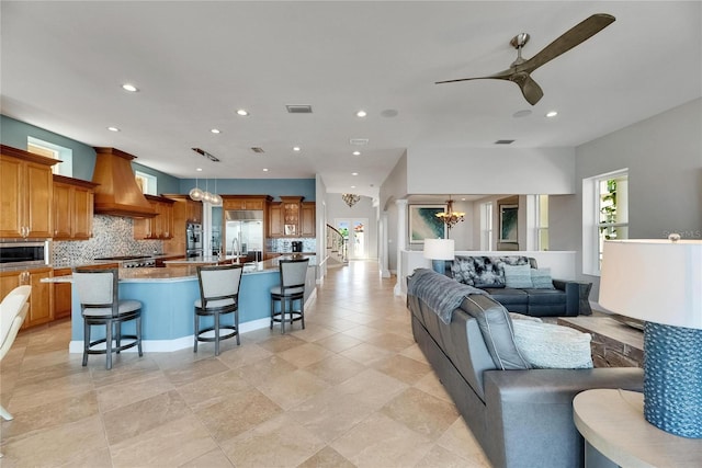 6418 Bright Bay Ct, Apollo Beach, FL 33572 - living room featuring a chandelier, a ceiling fan, and recessed lighting