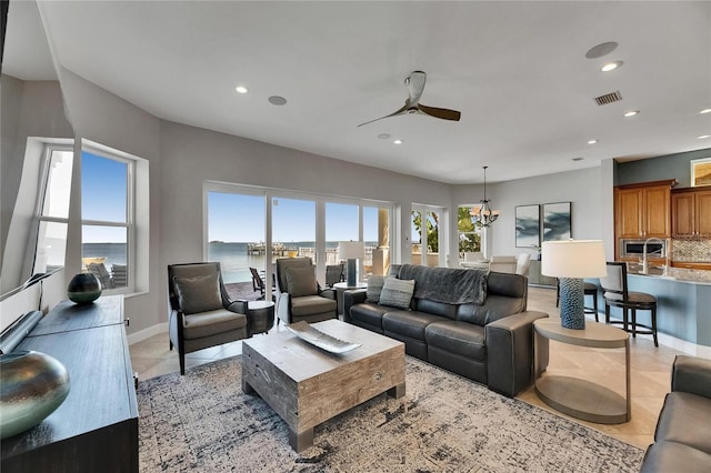 6418 Bright Bay Ct, Apollo Beach, FL 33572 - living room featuring ceiling fan, recessed lighting, light tile patterned flooring, and a chandelier