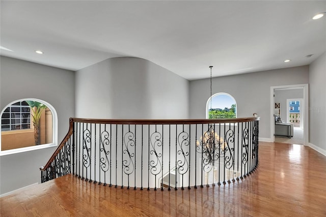 6418 Bright Bay Ct, Apollo Beach, FL 33572 - corridor with an upstairs landing, wood finished floors, and recessed lighting