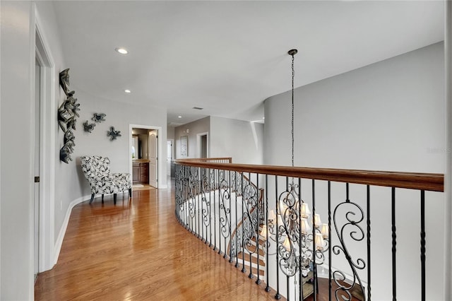 6418 Bright Bay Ct, Apollo Beach, FL 33572 - hall with wood finished floors, recessed lighting, and an upstairs landing