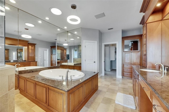 6418 Bright Bay Ct, Apollo Beach, FL 33572 - full bath with two vanities, a bath, tile patterned floors, and recessed lighting