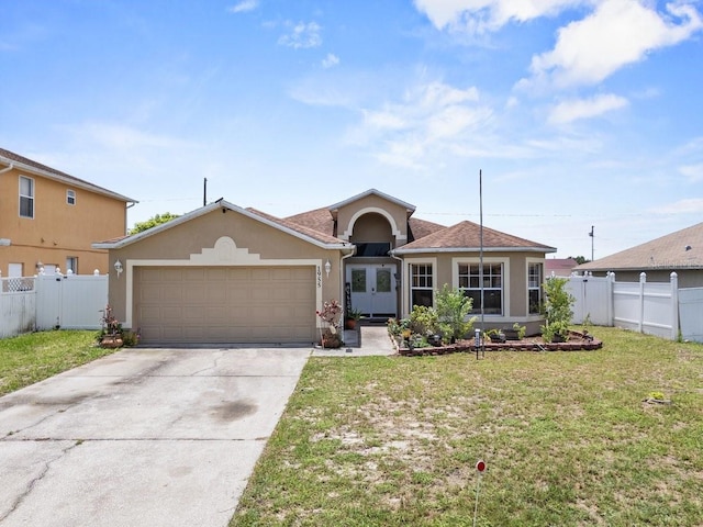 1955 Manatee Ct, Kissimmee, FL 34759 - view of front of home with stucco siding, a garage, concrete driveway, and french doors