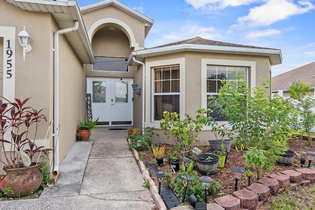 1955 Manatee Ct, Kissimmee, FL 34759 - property entrance with stucco siding and french doors