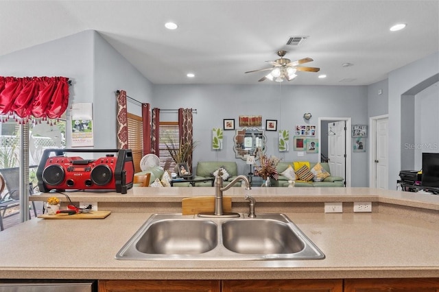 1955 Manatee Ct, Kissimmee, FL 34759 - kitchen with open floor plan, recessed lighting, a ceiling fan, and light countertops