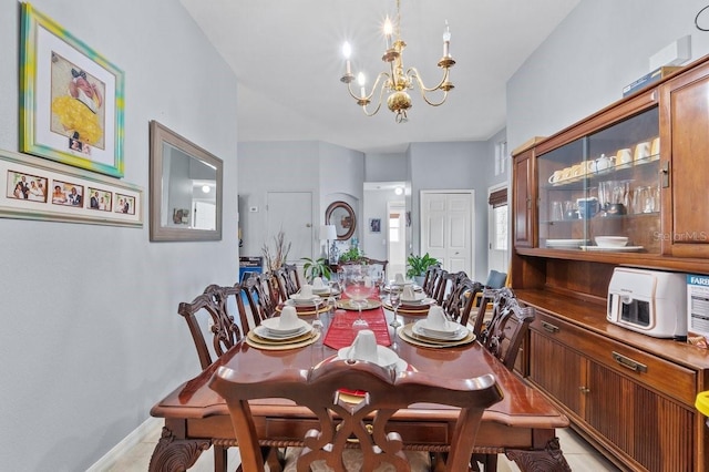 1955 Manatee Ct, Kissimmee, FL 34759 - dining space featuring a chandelier and light tile patterned floors