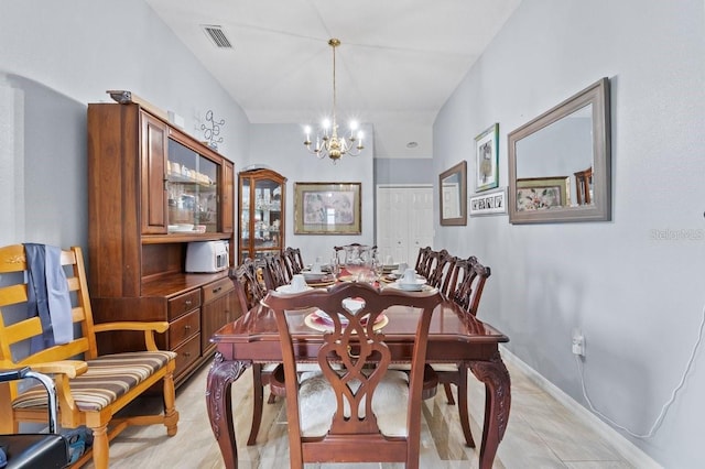 1955 Manatee Ct, Kissimmee, FL 34759 - dining room with a chandelier and light tile patterned flooring