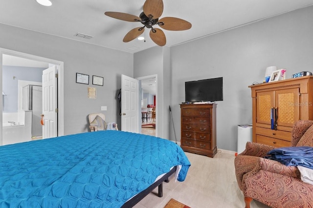 1955 Manatee Ct, Kissimmee, FL 34759 - bedroom featuring ceiling fan and ensuite bath