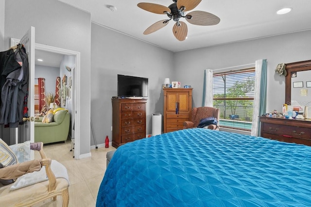 1955 Manatee Ct, Kissimmee, FL 34759 - bedroom featuring light tile patterned floors and ceiling fan