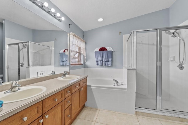 1955 Manatee Ct, Kissimmee, FL 34759 - full bath featuring double vanity, a bath, a shower stall, and tile patterned floors