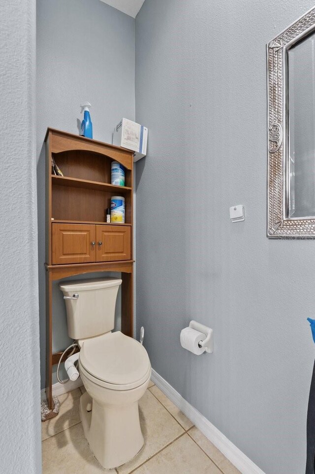 1955 Manatee Ct, Kissimmee, FL 34759 - bathroom with toilet and tile patterned flooring