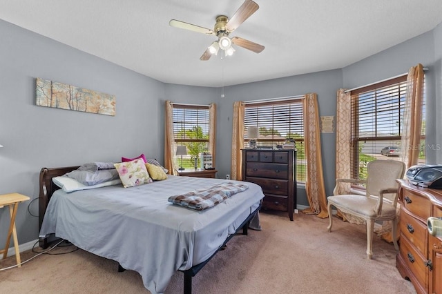 1955 Manatee Ct, Kissimmee, FL 34759 - bedroom with light carpet and ceiling fan
