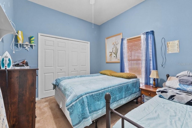 1955 Manatee Ct, Kissimmee, FL 34759 - bedroom featuring a closet and light carpet