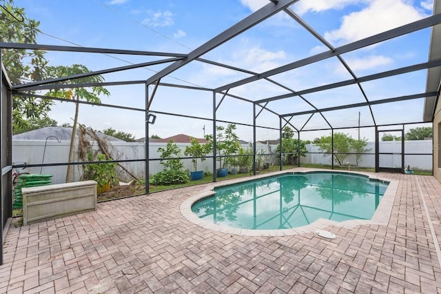 1955 Manatee Ct, Kissimmee, FL 34759 - view of swimming pool with a patio area, a fenced backyard, and a lanai