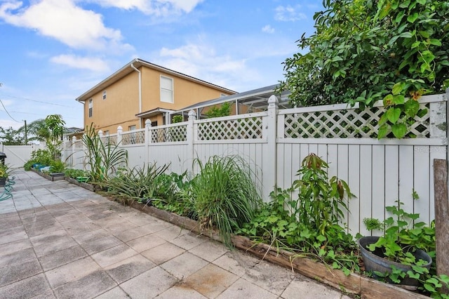 1955 Manatee Ct, Kissimmee, FL 34759 - fenced backyard featuring a patio